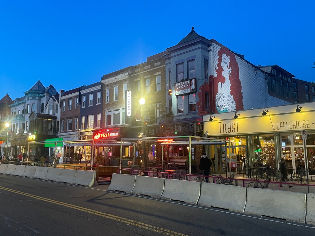 Night view of the vibrant restaurants and bars of Washington's Adams Morgan Neighborhood, where our DC food tours explore